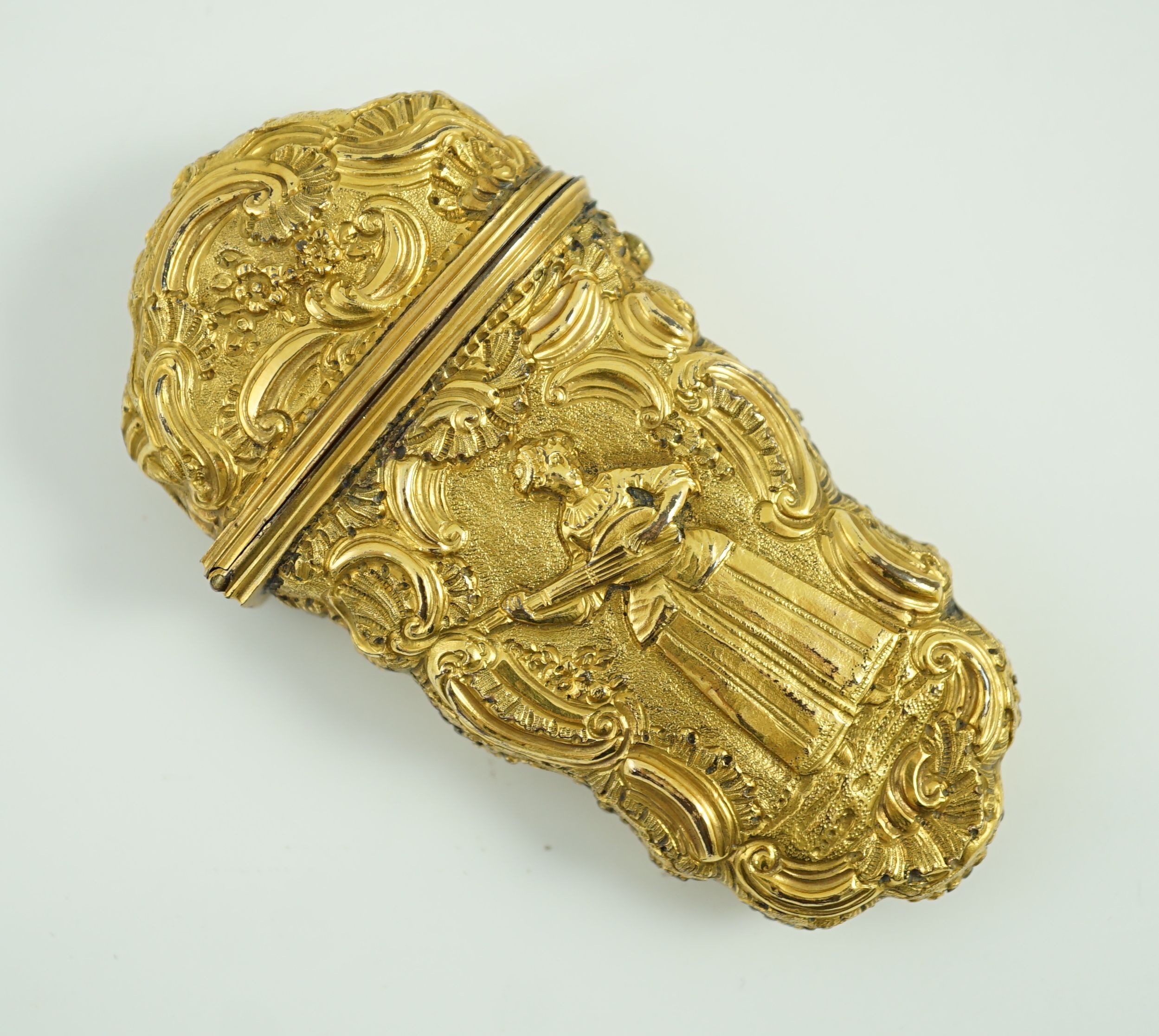 A George III gilt metal etui containing accessories, 10cms high.